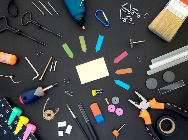 A collection of office supplies laid out on a table.